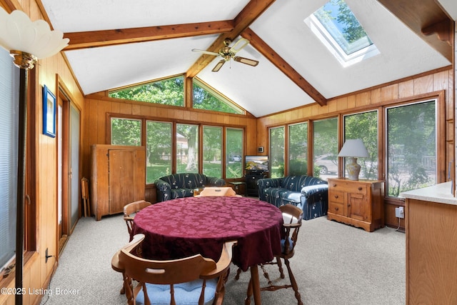 7103 Green Spring Dr, Louisville, KY 40241 - dining space featuring light colored carpet, a skylight, wood walls, and a ceiling fan