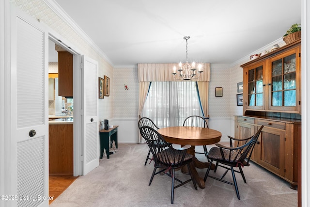 7103 Green Spring Dr, Louisville, KY 40241 - dining area with wallpapered walls, a chandelier, ornamental molding, and a wainscoted wall