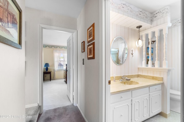 7103 Green Spring Dr, Louisville, KY 40241 - ensuite bathroom featuring toilet, vanity, and baseboards