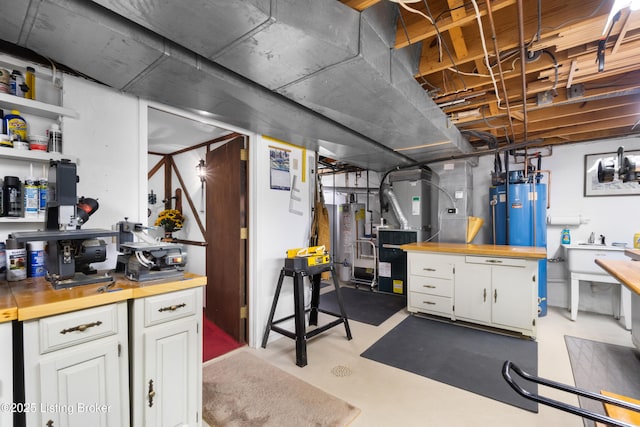 7103 Green Spring Dr, Louisville, KY 40241 - unfinished below grade area with gas water heater, a sink, and heating unit