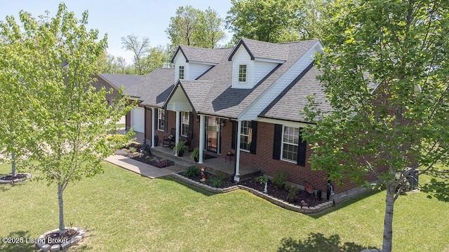 113 Chattanooga Dr, Coxs Creek, KY 40013 - view of front of house featuring roof with shingles, covered porch, a front yard, and brick siding