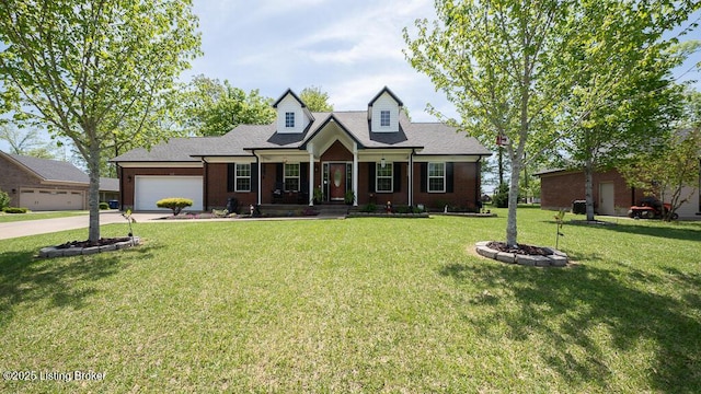 113 Chattanooga Dr, Coxs Creek, KY 40013 - new england style home featuring a front yard, a garage, covered porch, driveway, and brick siding