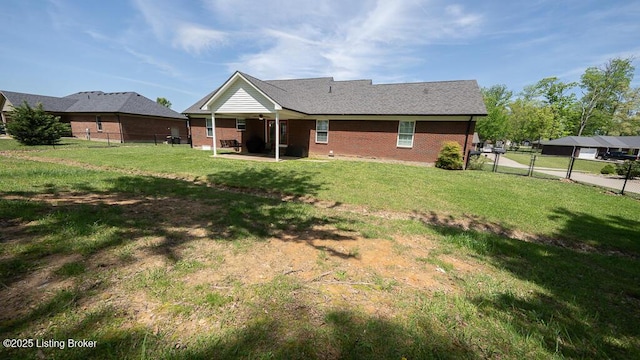 113 Chattanooga Dr, Coxs Creek, KY 40013 - back of property with a yard, a patio area, brick siding, and a fenced backyard