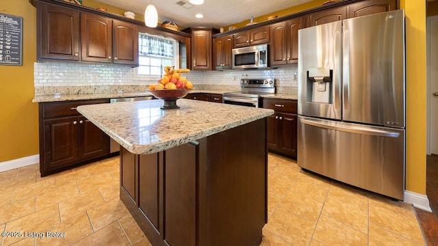 113 Chattanooga Dr, Coxs Creek, KY 40013 - kitchen with baseboards, dark brown cabinetry, and appliances with stainless steel finishes
