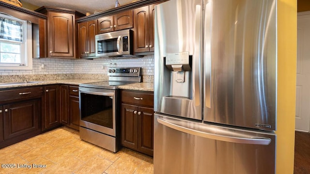 113 Chattanooga Dr, Coxs Creek, KY 40013 - kitchen featuring appliances with stainless steel finishes, light stone counters, tasteful backsplash, and a sink