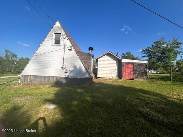 89 Peach St, New Haven, KY 40051 - view of side of home with an outbuilding and a lawn