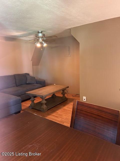 89 Peach St, New Haven, KY 40051 - living area featuring a textured ceiling, ceiling fan, and wood finished floors