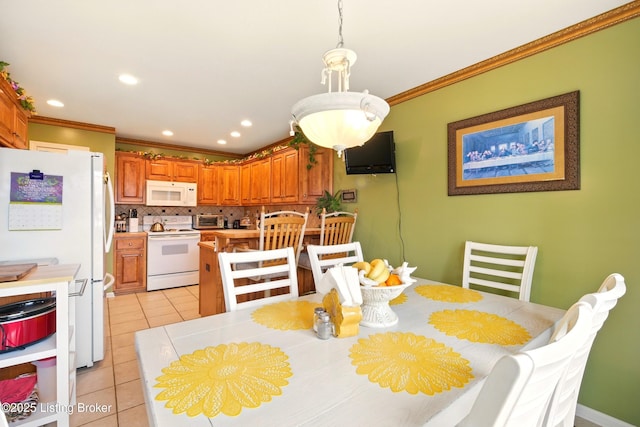 dining area with ornamental molding, light tile patterned flooring, and recessed lighting