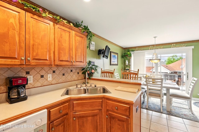 kitchen with dishwasher, a peninsula, light tile patterned flooring, a sink, and light countertops