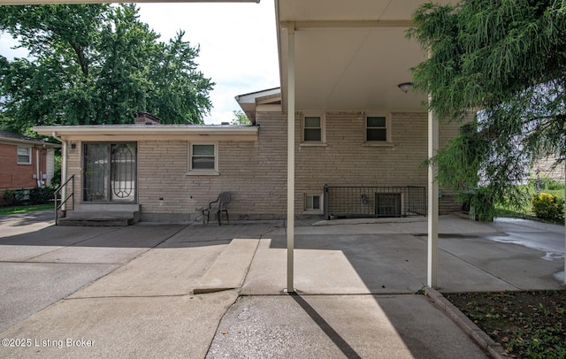 8701 Cottingham Way, Louisville, KY 40258 - rear view of property featuring a patio area and brick siding
