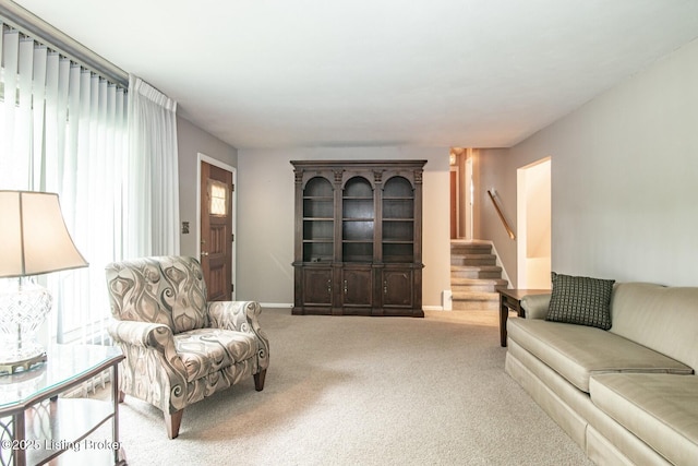 8701 Cottingham Way, Louisville, KY 40258 - carpeted living area featuring stairway and baseboards