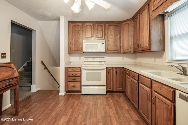 8701 Cottingham Way, Louisville, KY 40258 - kitchen with white appliances, a sink, dark wood-style flooring, brown cabinetry, and light countertops