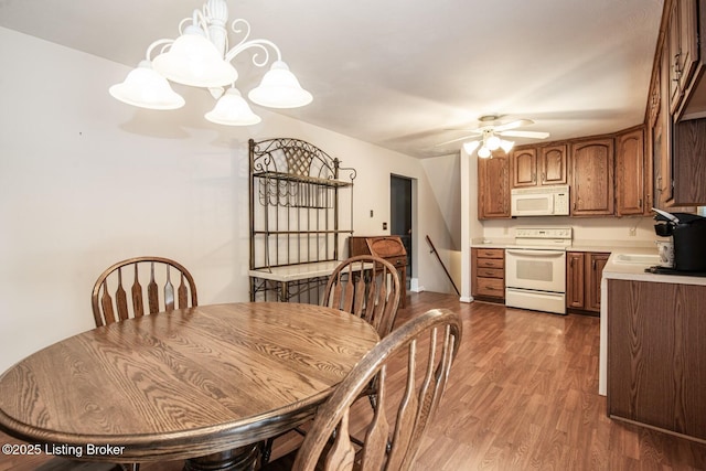 8701 Cottingham Way, Louisville, KY 40258 - dining area featuring ceiling fan, dark wood finished floors, and a chandelier