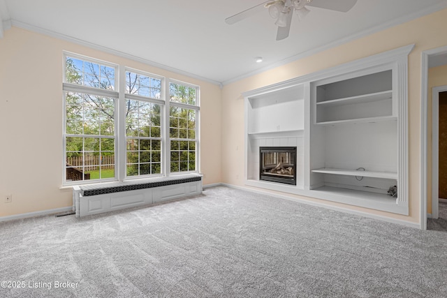 8507 Missionary Ct, Louisville, KY 40291 - unfurnished living room with carpet floors, ornamental molding, built in features, a tiled fireplace, and a ceiling fan