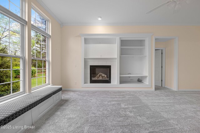 8507 Missionary Ct, Louisville, KY 40291 - unfurnished living room featuring built in shelves, carpet floors, baseboards, and a tile fireplace