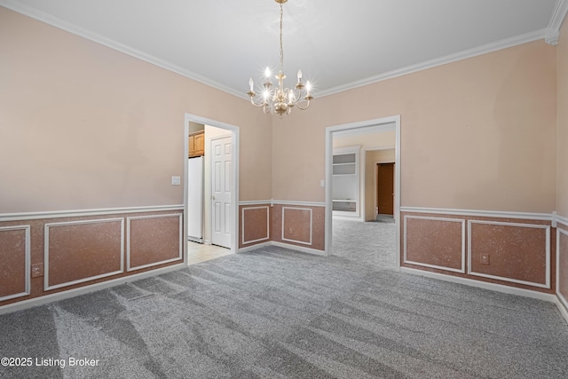8507 Missionary Ct, Louisville, KY 40291 - carpeted empty room featuring crown molding, a decorative wall, an inviting chandelier, and a wainscoted wall