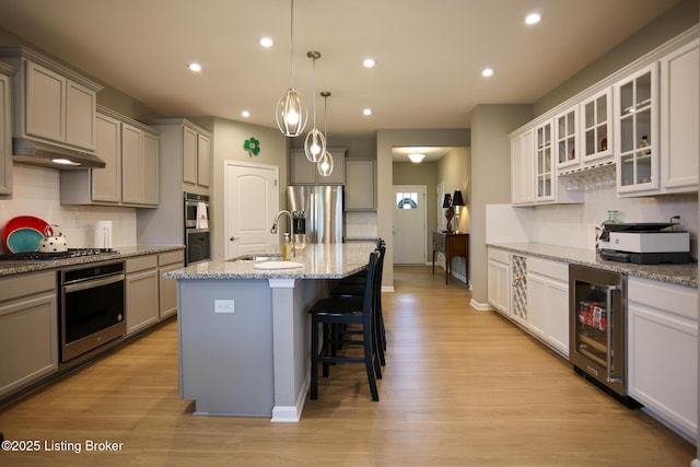2854 Hamilton Springs Dr, Louisville, KY 40245 - kitchen featuring a sink, wine cooler, appliances with stainless steel finishes, under cabinet range hood, and gray cabinets