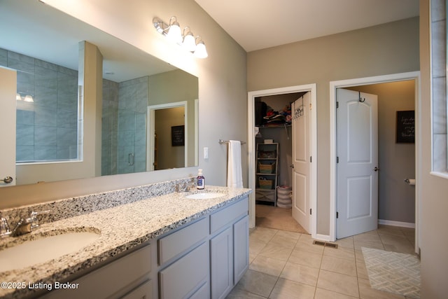 2854 Hamilton Springs Dr, Louisville, KY 40245 - bathroom with a stall shower, tile patterned floors, a walk in closet, and double vanity