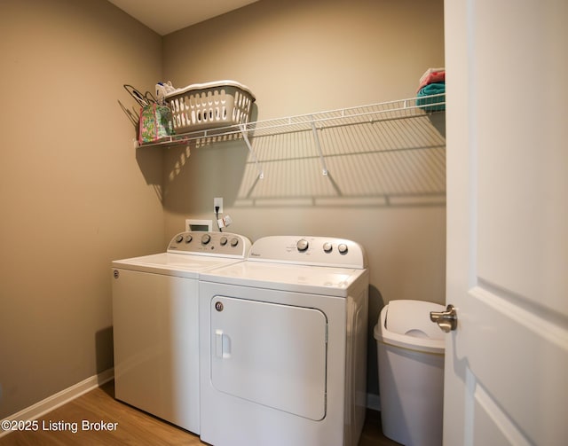 2854 Hamilton Springs Dr, Louisville, KY 40245 - laundry area featuring separate washer and dryer, wood finished floors, and baseboards