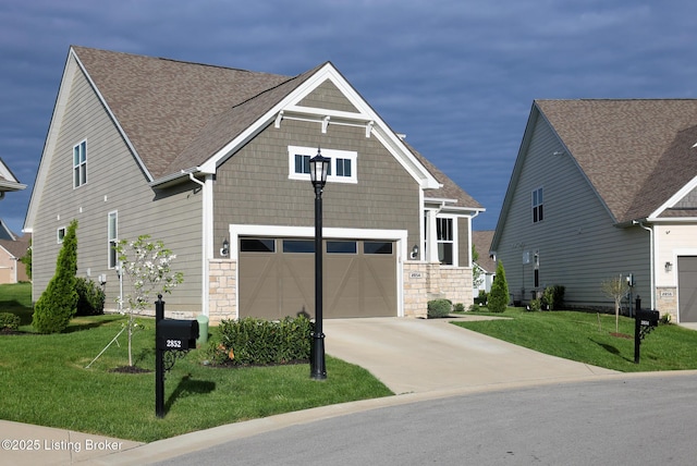 2854 Hamilton Springs Dr, Louisville, KY 40245 - craftsman inspired home with driveway, an attached garage, a front lawn, and stone siding
