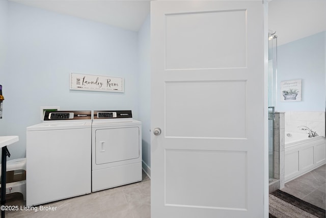laundry room with laundry area and washing machine and clothes dryer