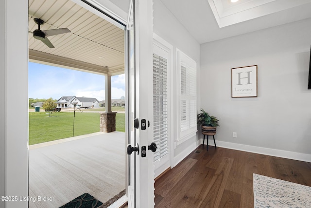 entryway with baseboards, a ceiling fan, and wood finished floors