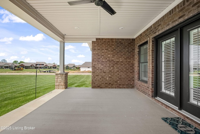 view of patio / terrace featuring ceiling fan and a residential view