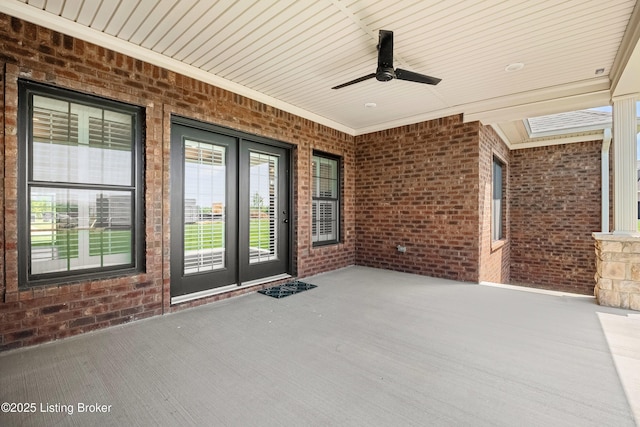 view of patio / terrace featuring a ceiling fan and french doors