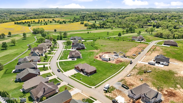 drone / aerial view with a wooded view