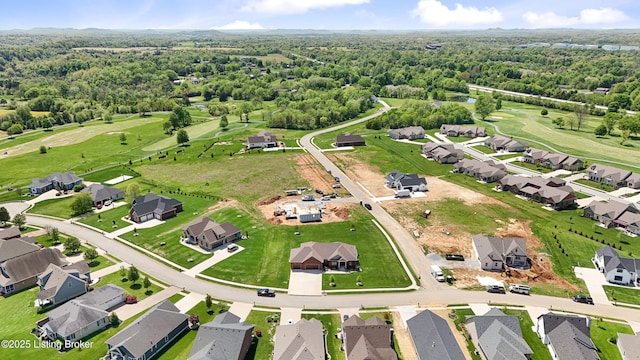 bird's eye view featuring a forest view, view of golf course, and a residential view