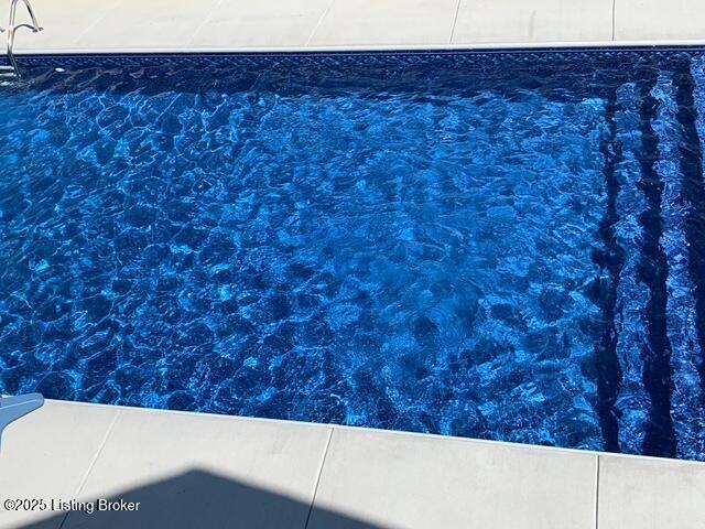 exterior details featuring a pool