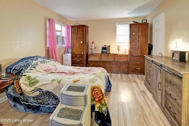 bedroom with light wood finished floors
