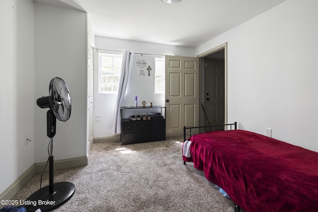 carpeted bedroom with baseboards