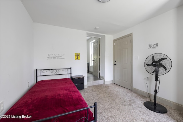 carpeted bedroom with baseboards