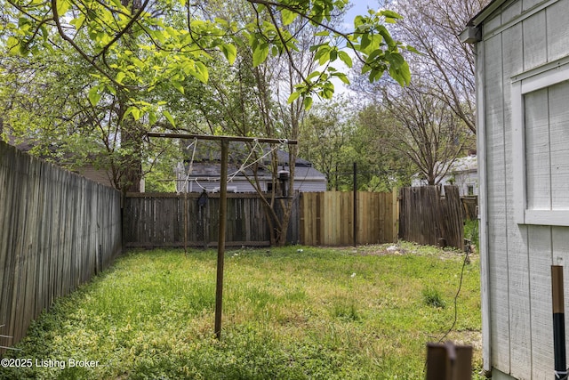 view of yard with a fenced backyard