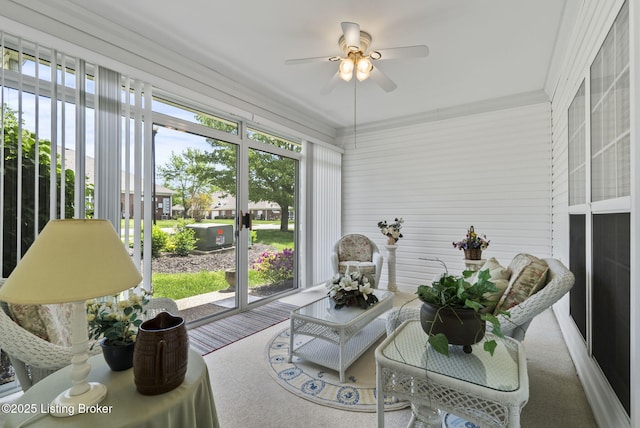 sunroom featuring a ceiling fan and a wealth of natural light