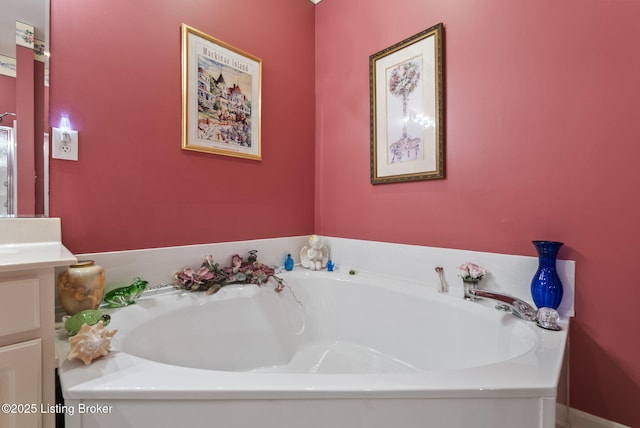 full bathroom featuring vanity and a garden tub