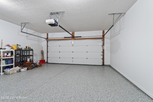garage featuring baseboards and a garage door opener