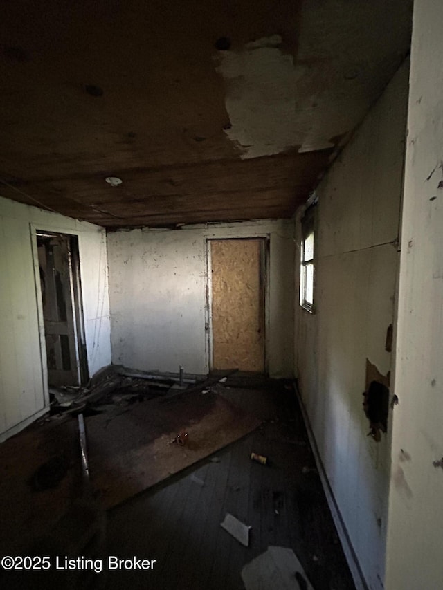 miscellaneous room with dark wood-type flooring