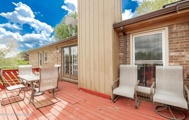 deck with outdoor dining area