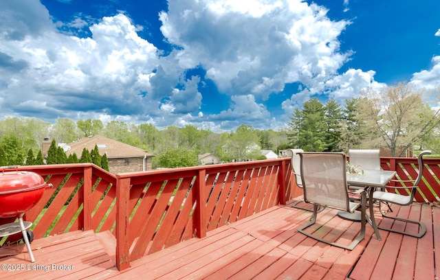 deck featuring outdoor dining area