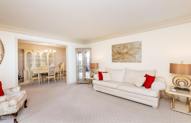 carpeted living room with ornamental molding and a chandelier