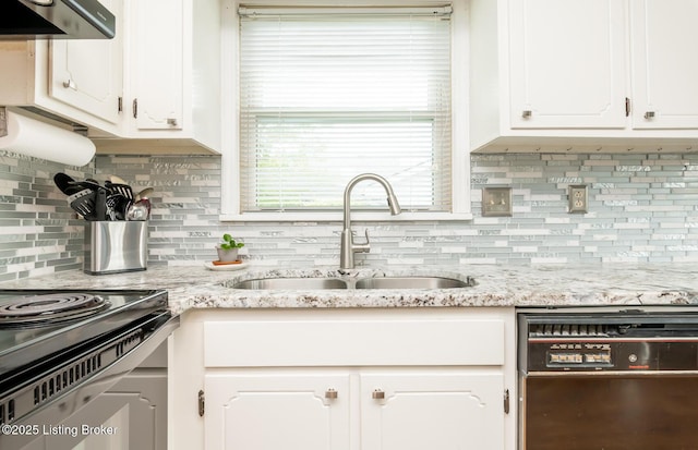 kitchen with a sink, black appliances, extractor fan, and white cabinetry