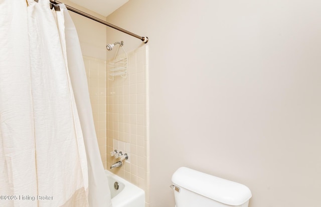 full bathroom with shower / bath combo with shower curtain and toilet