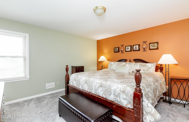 bedroom with baseboards and carpet flooring
