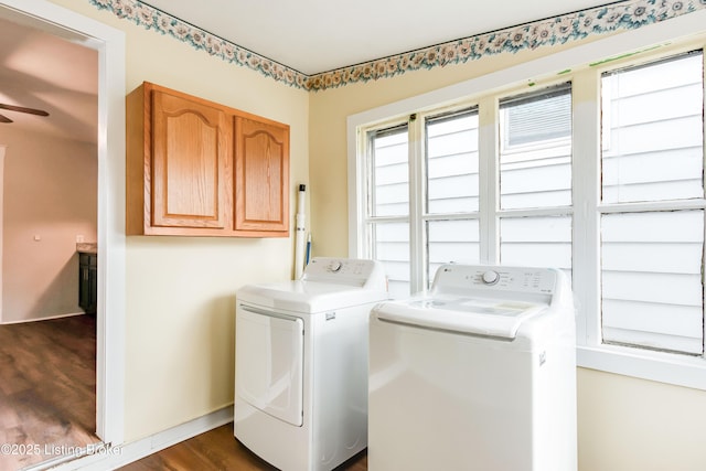 laundry room featuring washer and dryer, ceiling fan, dark wood-style floors, and cabinet space