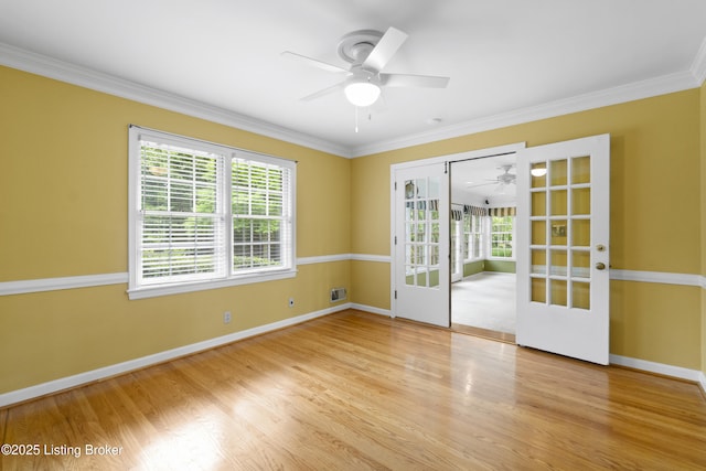 2224 Wynnewood Cir, Louisville, KY 40222 - unfurnished room featuring ceiling fan, french doors, plenty of natural light, baseboards, and ornamental molding