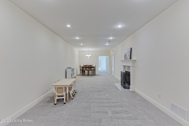 interior space with visible vents, recessed lighting, carpet, and baseboards