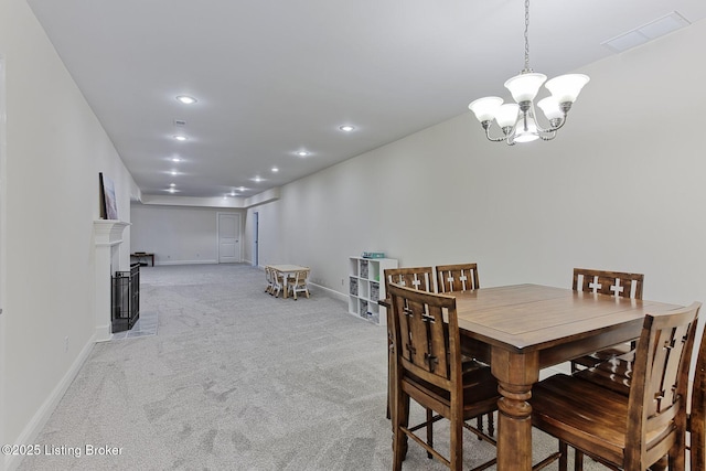 dining room with an inviting chandelier, visible vents, baseboards, recessed lighting, and light colored carpet