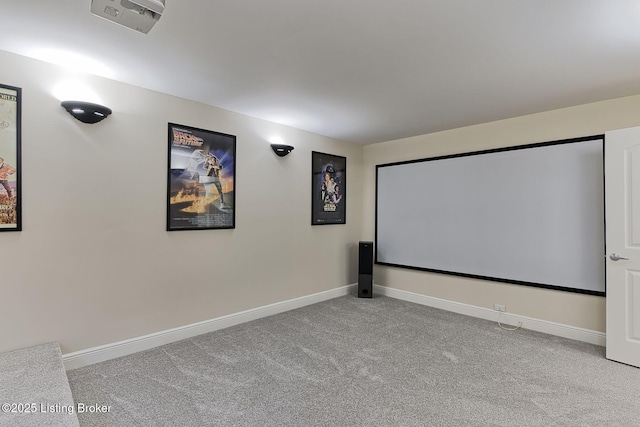 home theater featuring carpet floors and baseboards
